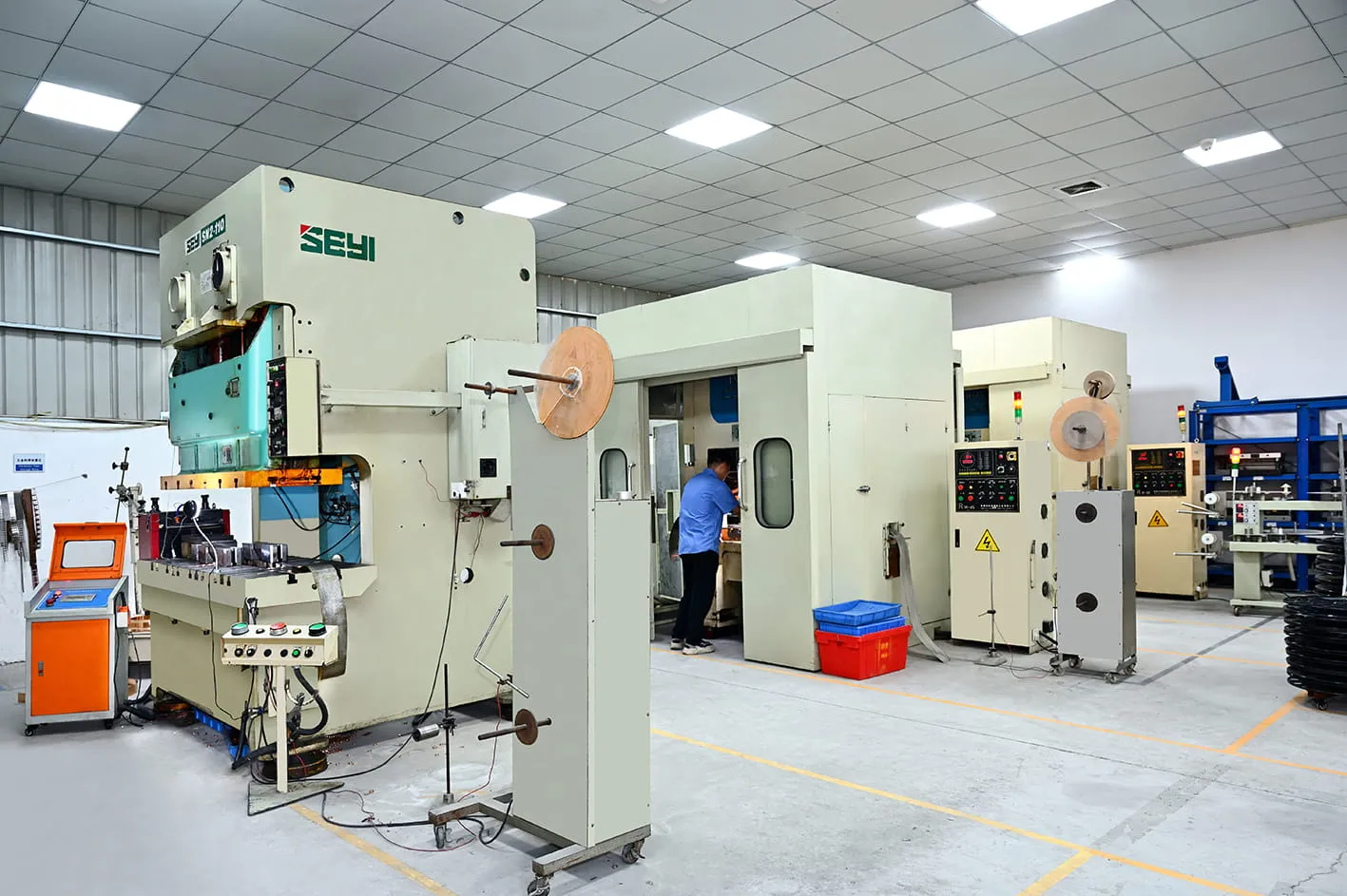 High-speed gantry stamping press producing metal inserts and brackets in our Dongguan plant