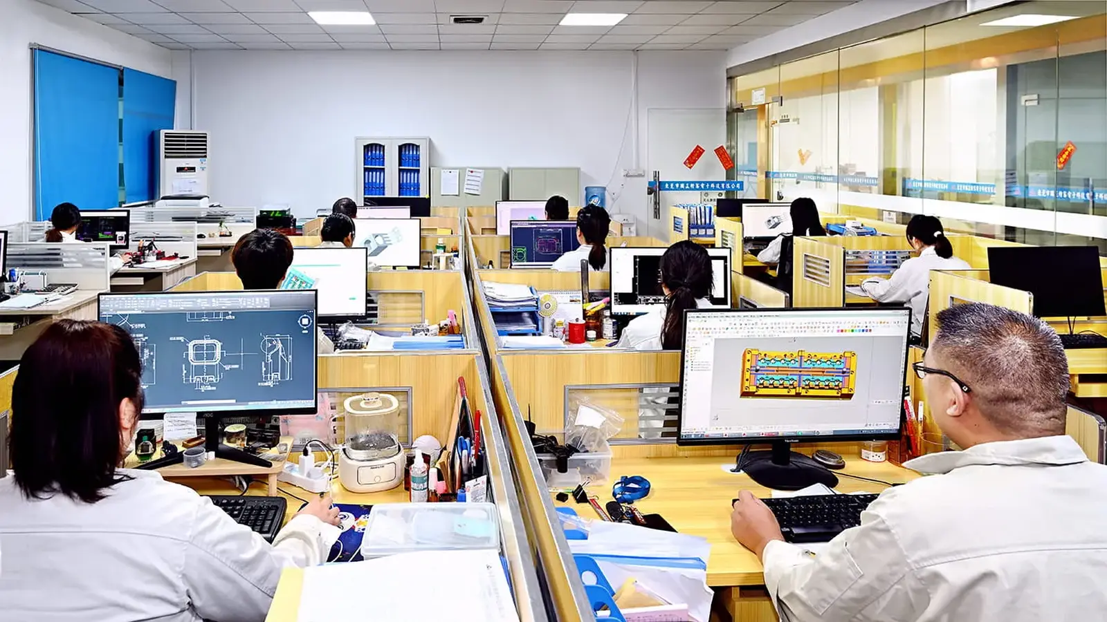 Sales and administration team working at their desks