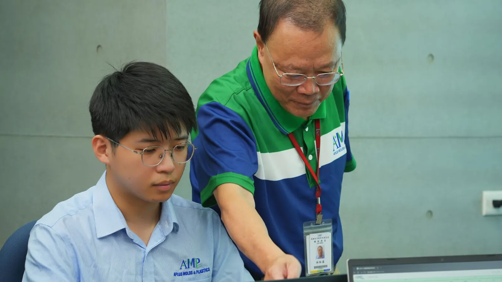 Engineers reviewing a live production dashboard on a monitoring wall