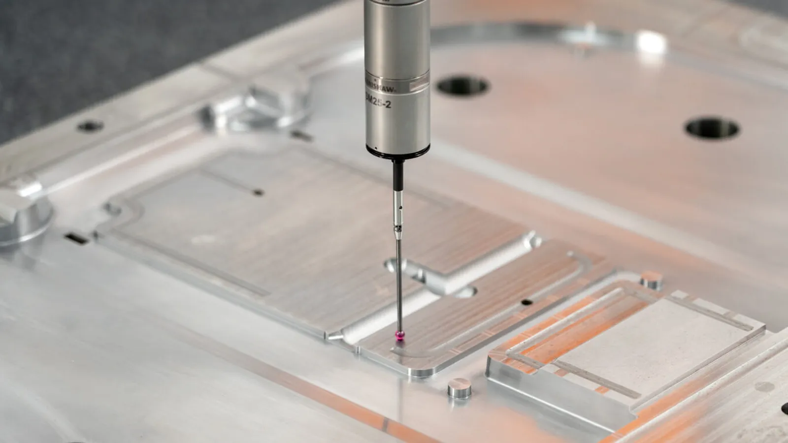 Technician inspecting molded parts at a quality gate