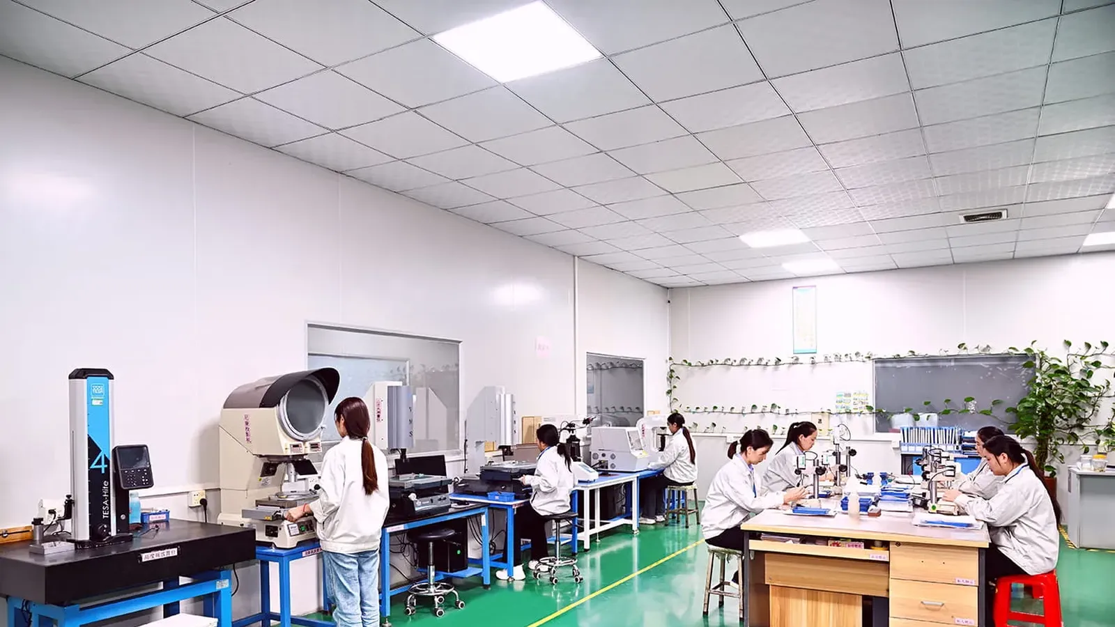 QC testing lab with inspection stations and staff