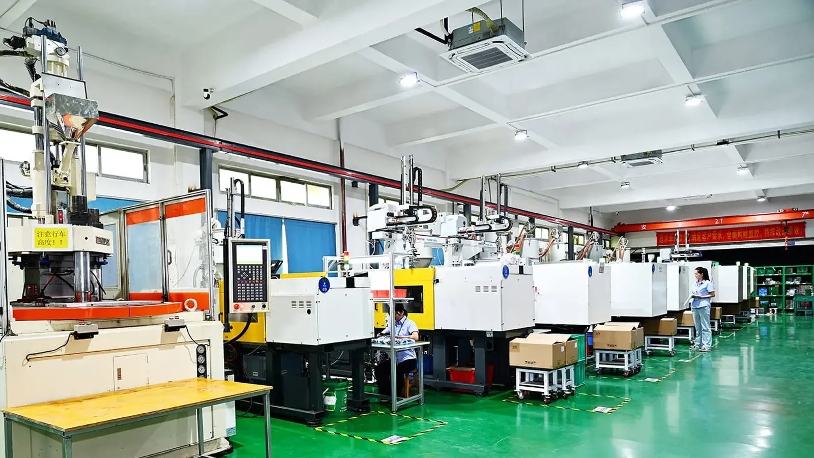 Rows of injection molding presses in the MOLDITQUICK molding hall