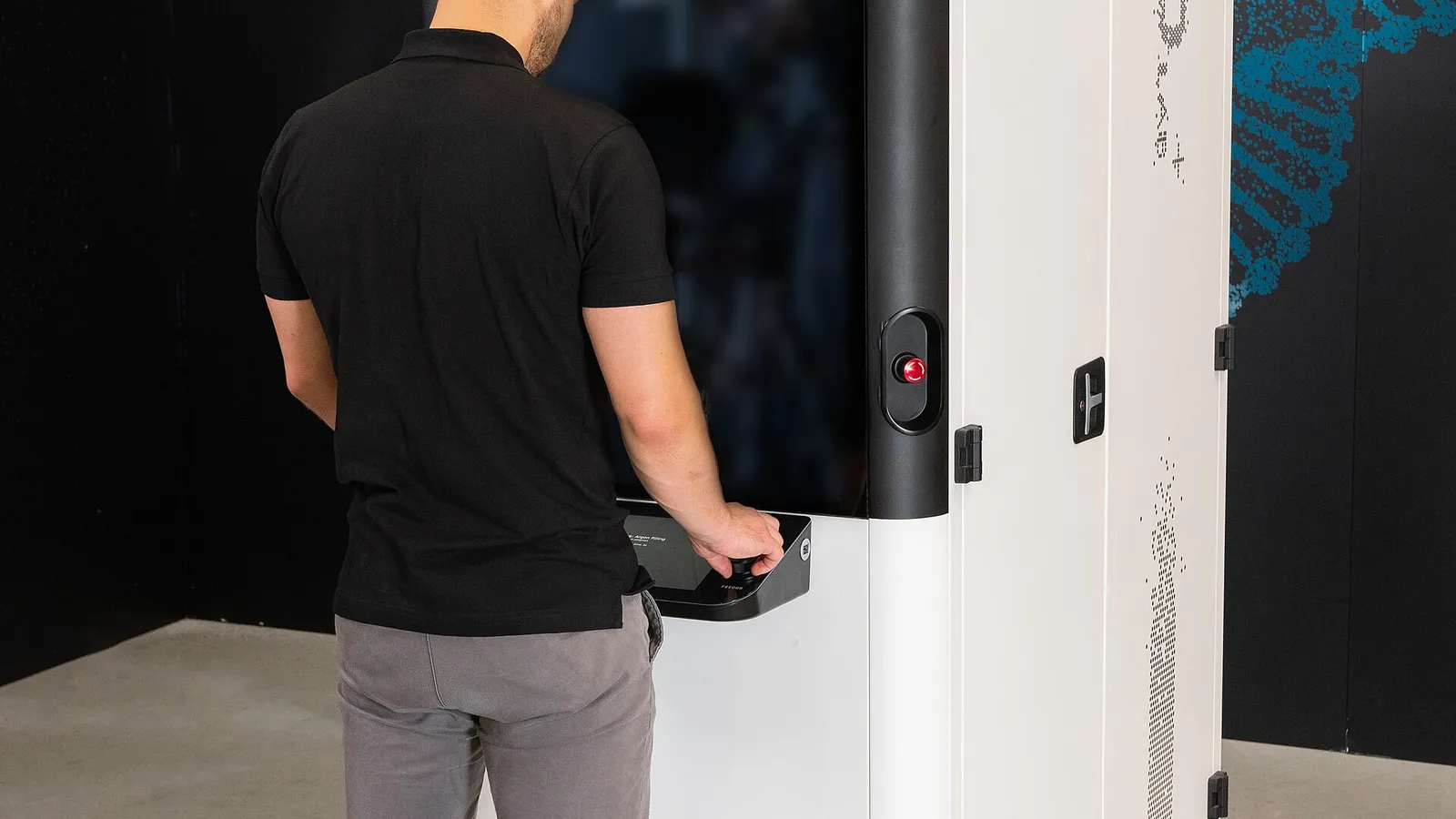 Technicians exchanging a freshly printed part at an industrial print cell